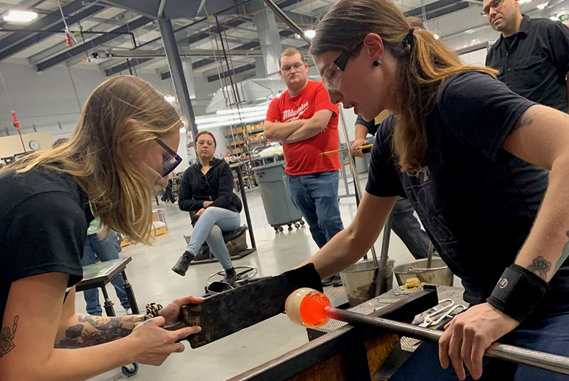 Patty Clune working in the glassblowing studio
